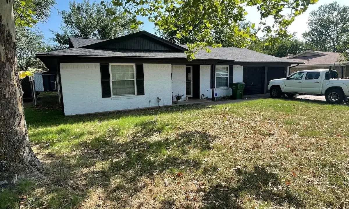 Professional roofing crew working on a residential roof in Newburyport